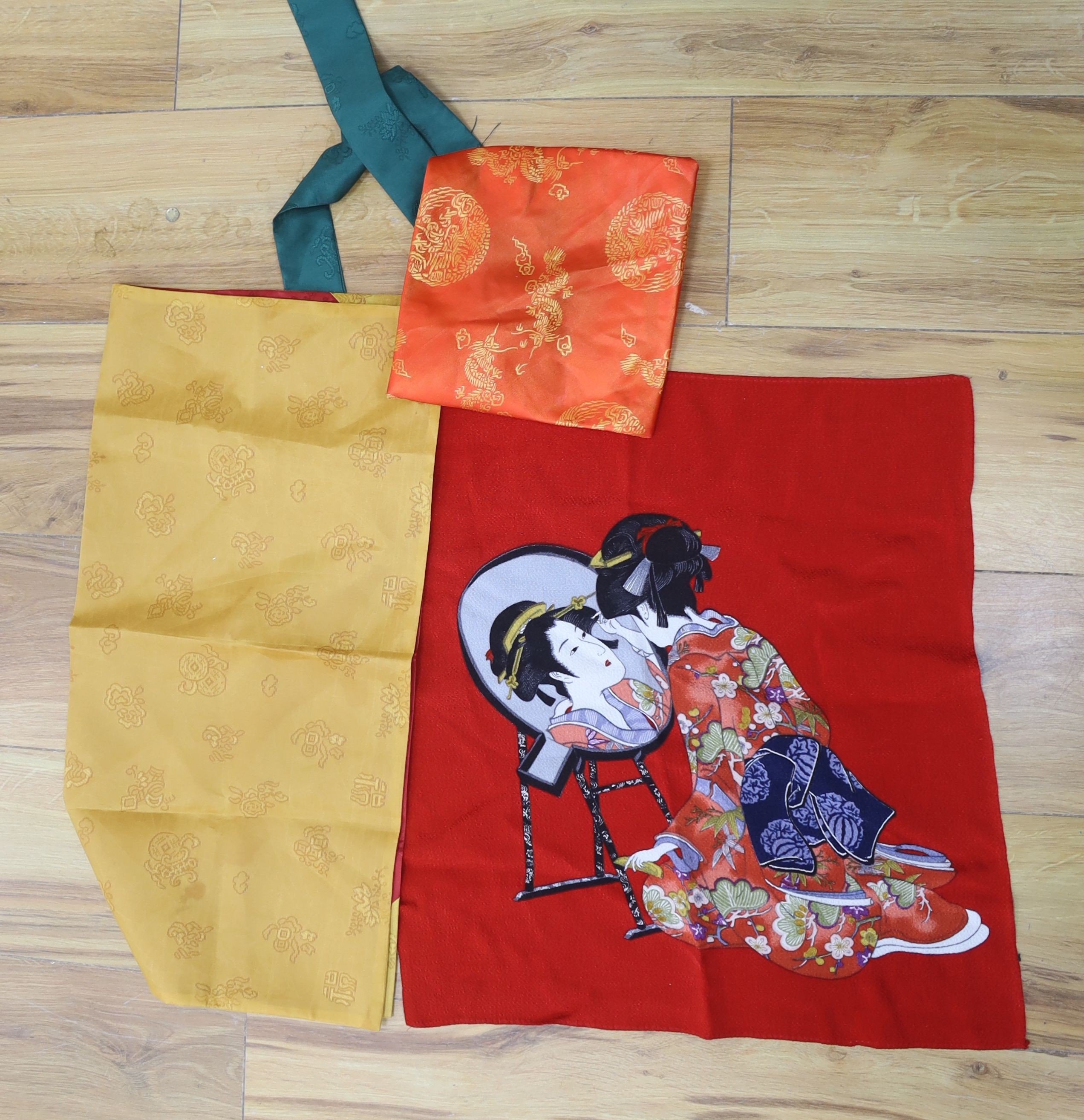 Two Japanese kite flags and various obi's and textiles